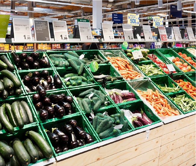 Fresh produce and vegetable aisle in a supermarket
